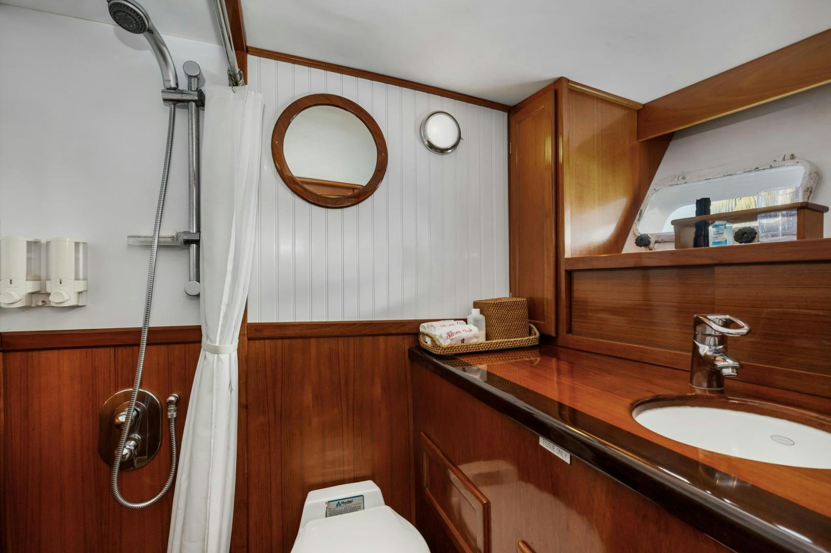 a bathroom with a sink and a shower aboard SILVER OAK Yacht for Sale