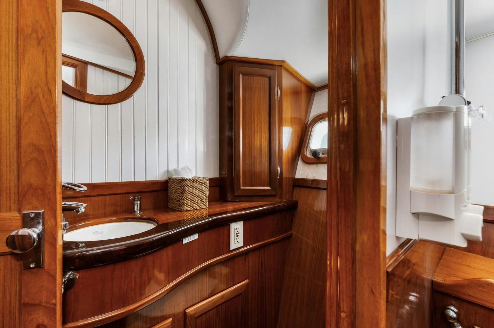 a bathroom with a sink and a mirror aboard SILVER OAK Yacht for Sale