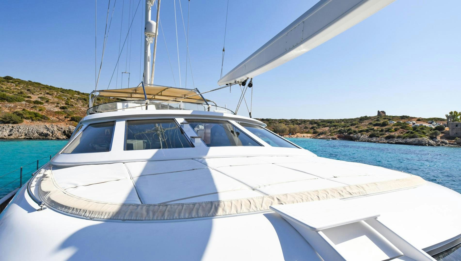 a white boat on the water aboard TAMARITA Yacht for Sale