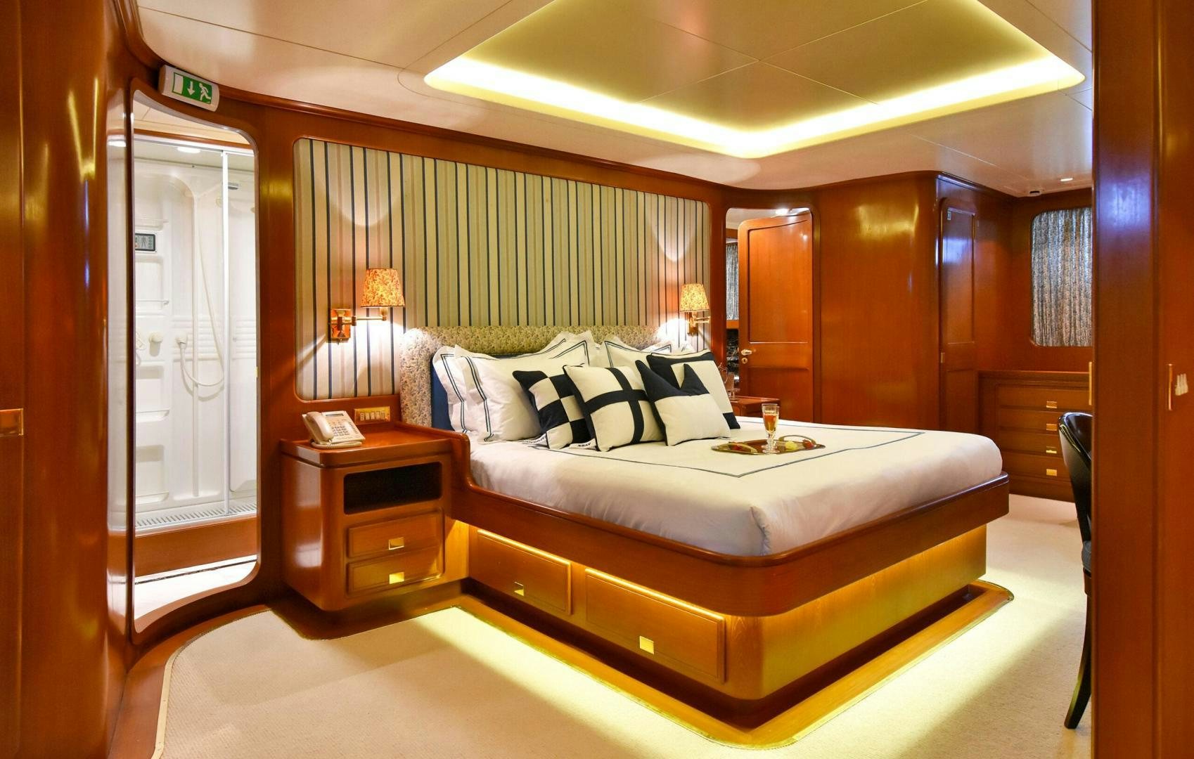 a bed in a room aboard TAMARITA Yacht for Sale