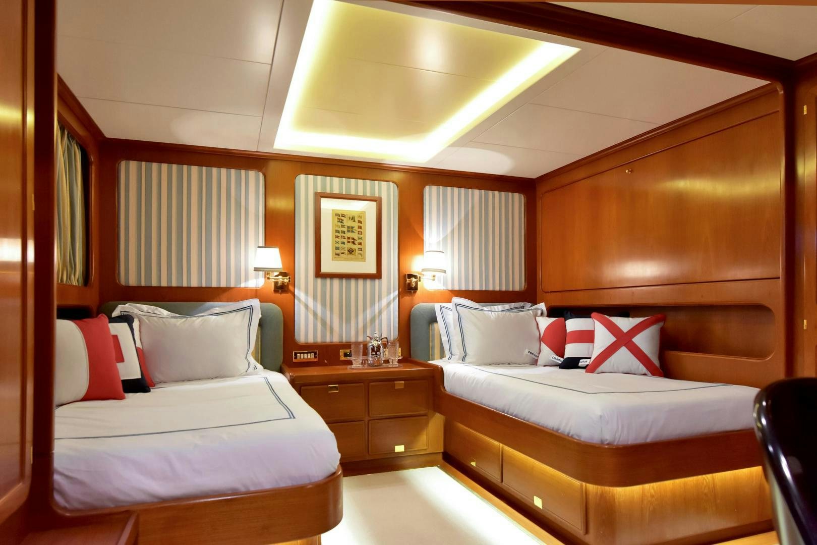 a room with two beds aboard TAMARITA Yacht for Sale