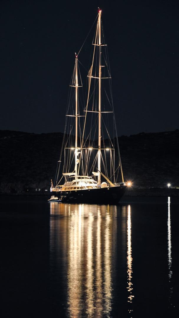 a sailboat at night aboard TAMARITA Yacht for Sale
