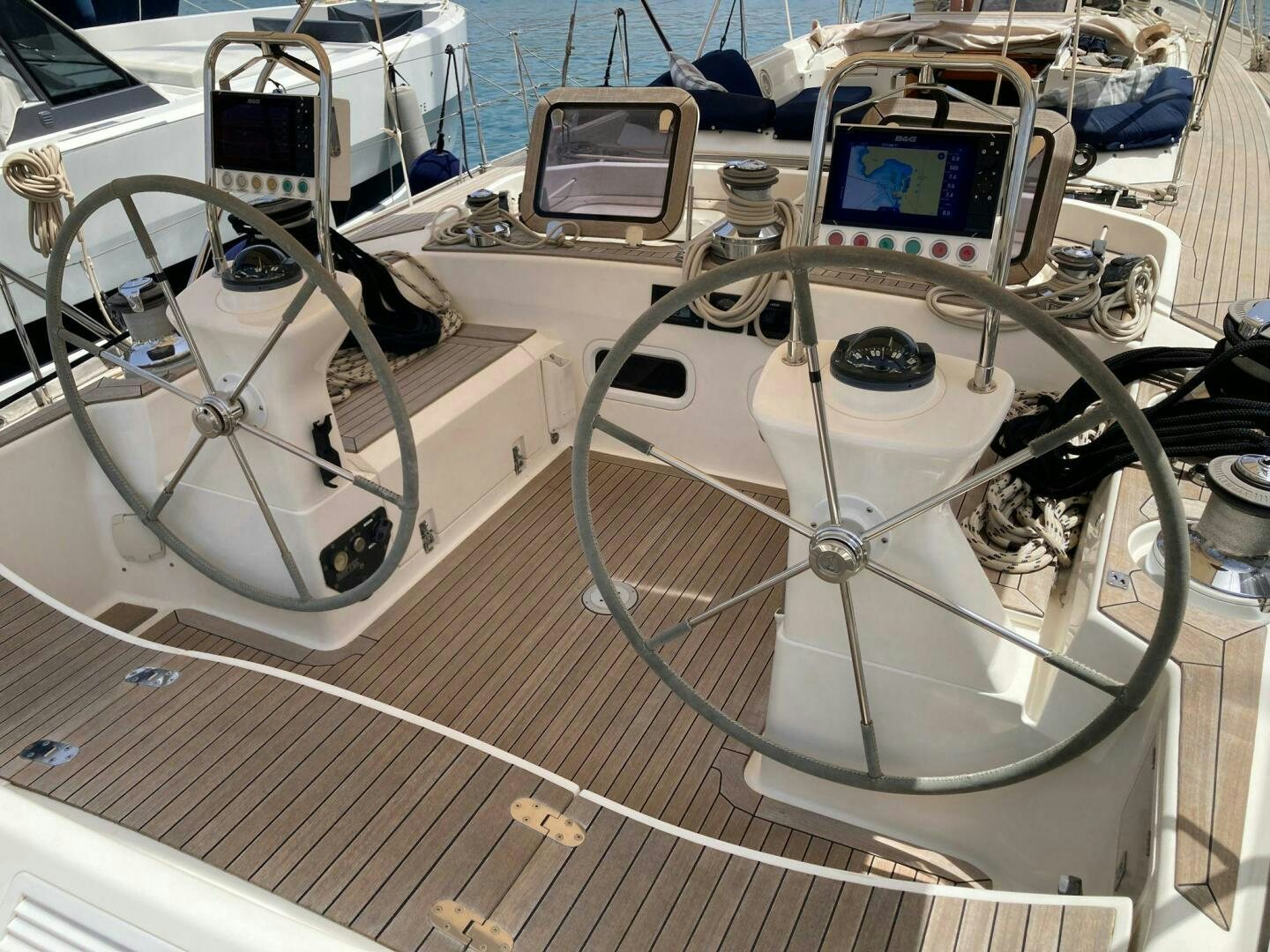 a white car with a steering wheel aboard INDIGO VII Yacht for Sale