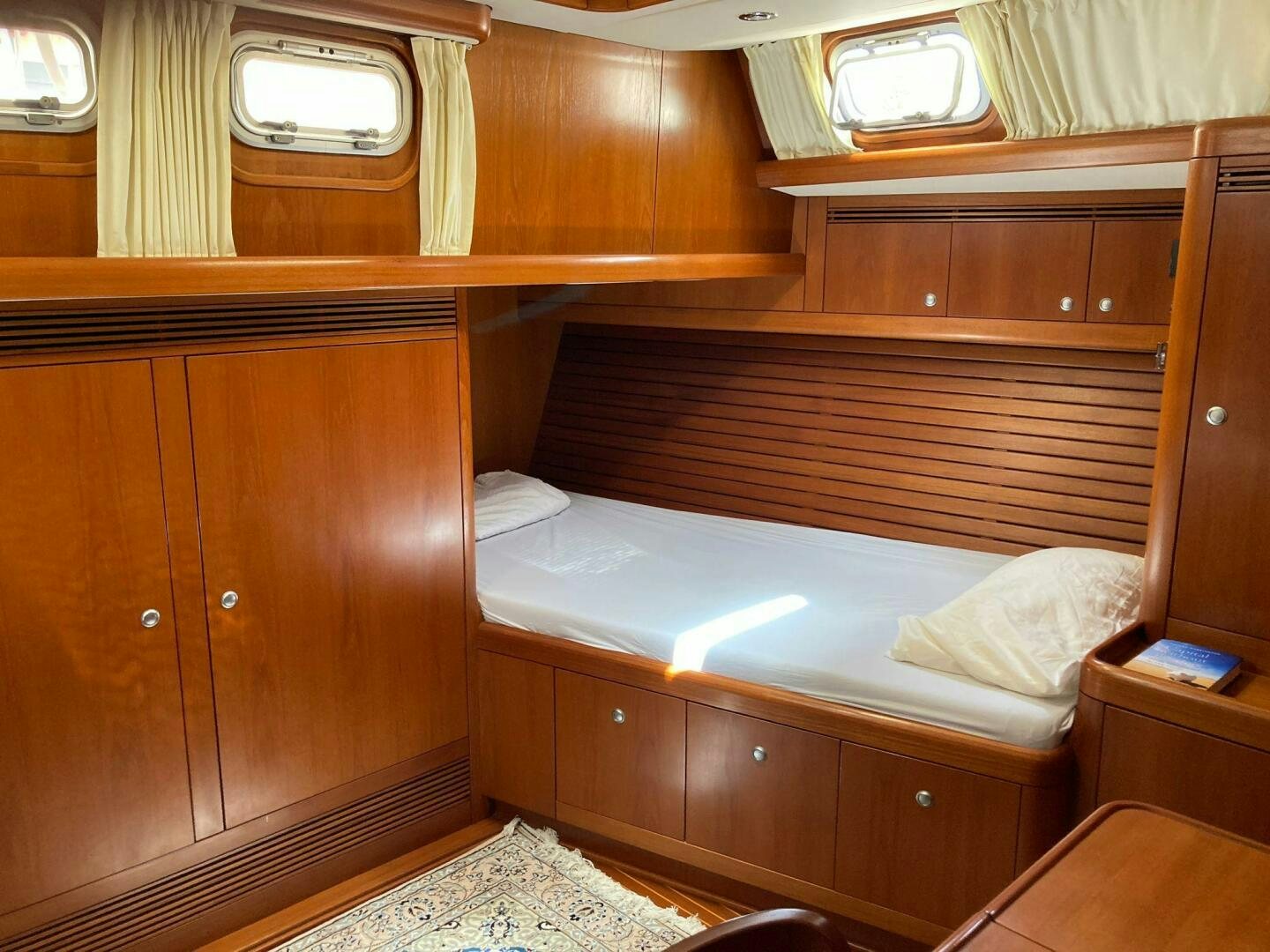 a room with bunk beds aboard INDIGO VII Yacht for Sale