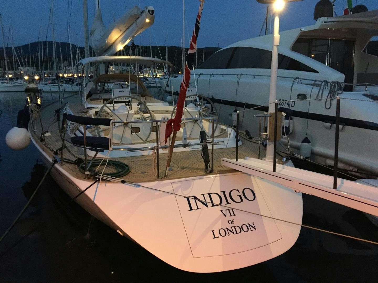 a boat docked at a pier aboard INDIGO VII Yacht for Sale