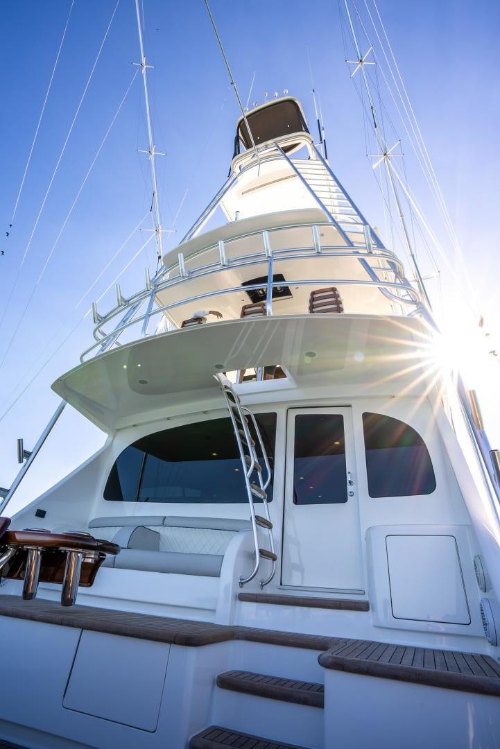 a white yacht with a bell on the front aboard Leslie Ann Yacht for Sale