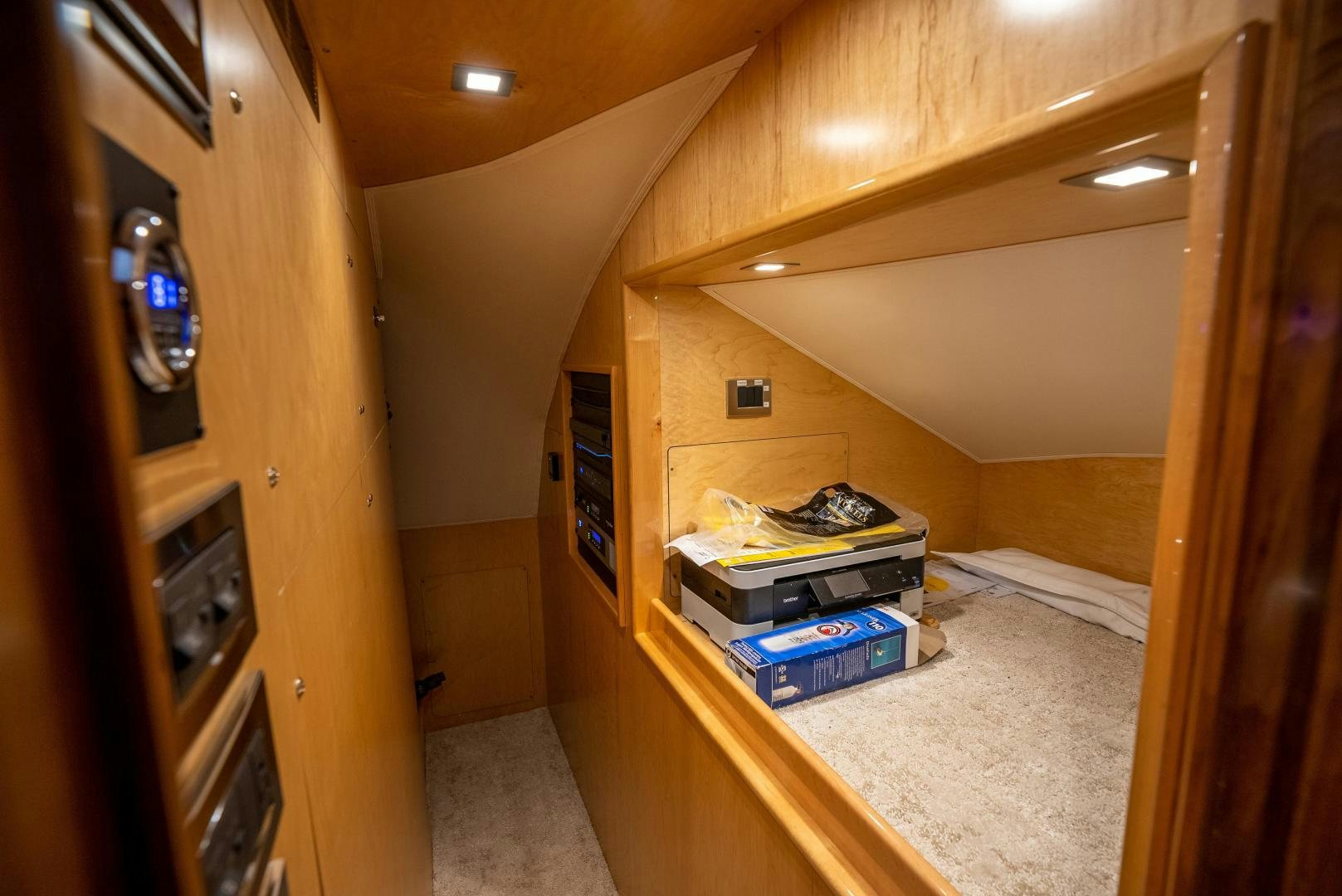 a room with a wood cabinet and a stove and a shelf with a fan and a fan aboard Leslie Ann Yacht for Sale