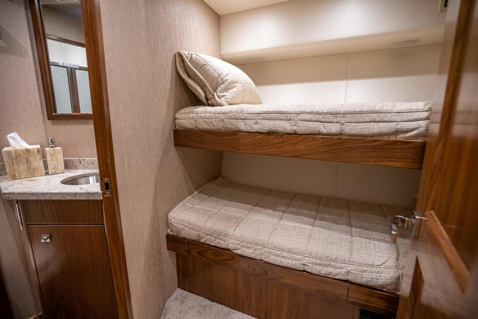 a bed with a white sheet aboard Leslie Ann Yacht for Sale