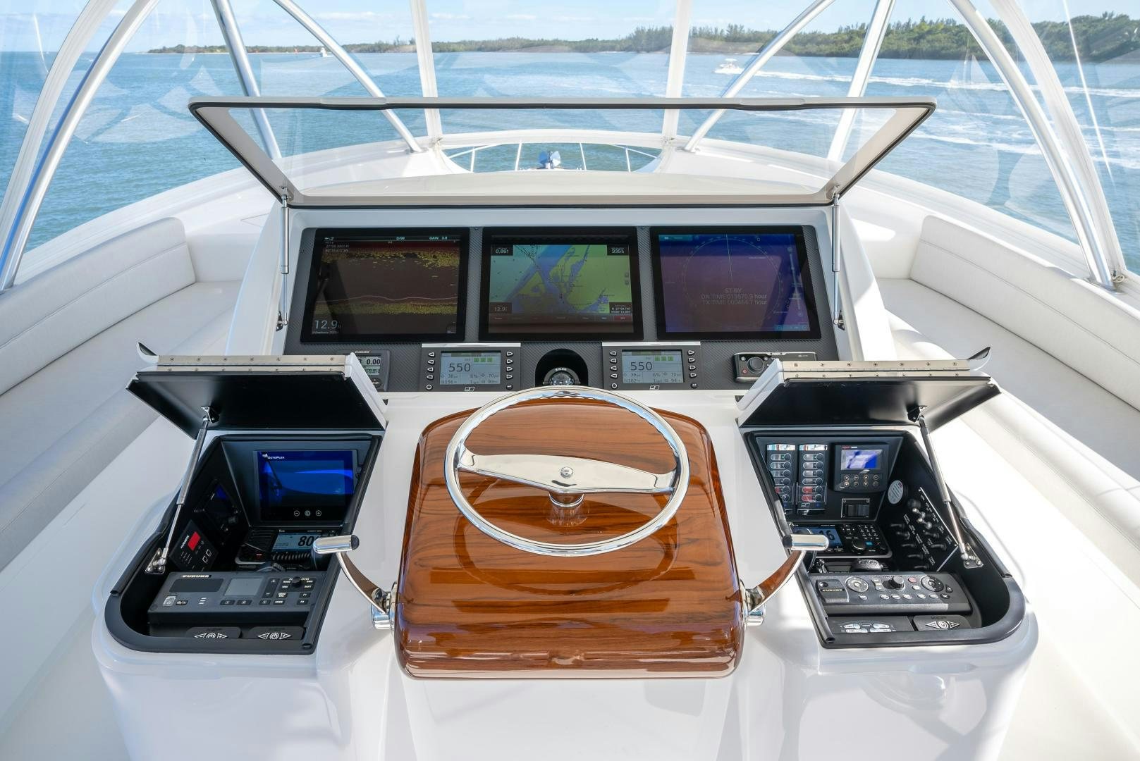 a couple of electronic devices on a table aboard Leslie Ann Yacht for Sale