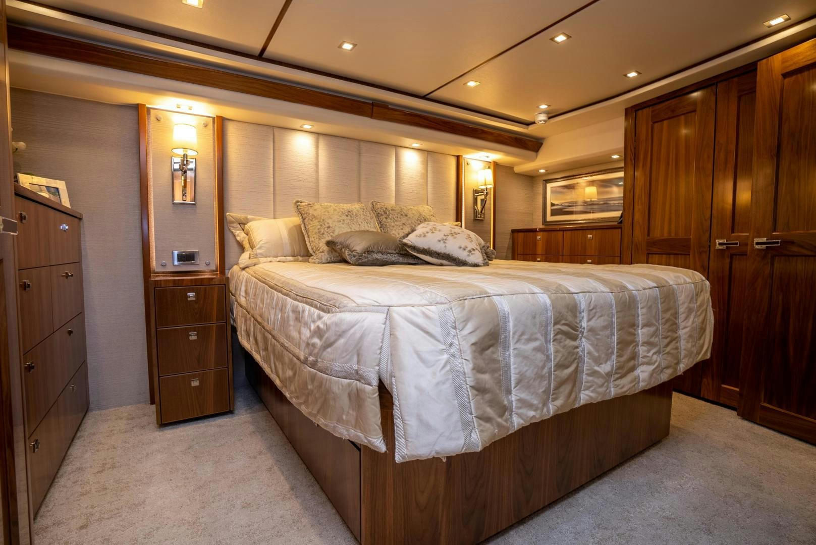a bedroom with a bed and a dresser aboard Leslie Ann Yacht for Sale