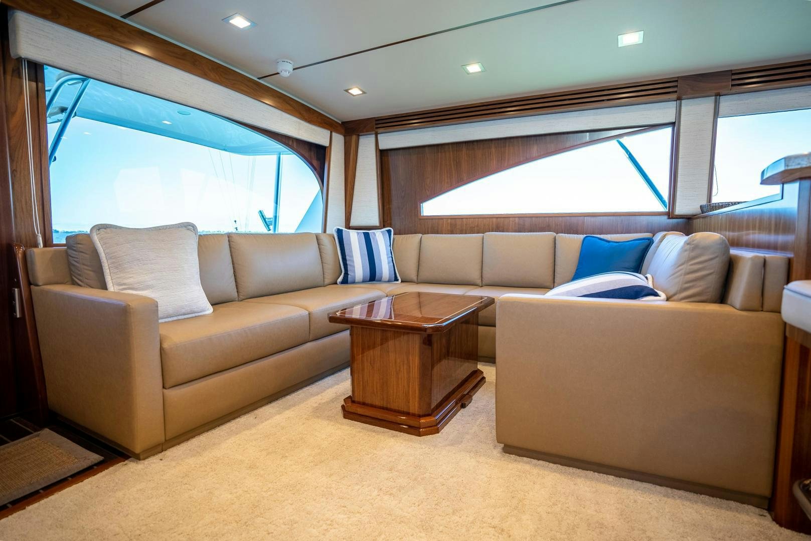 a living room with a couch and a table aboard Leslie Ann Yacht for Sale