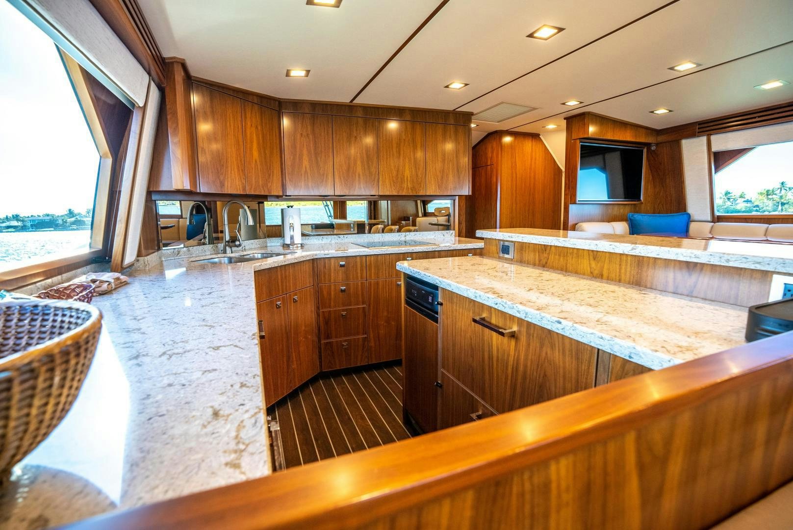 a kitchen with wooden cabinets aboard Leslie Ann Yacht for Sale