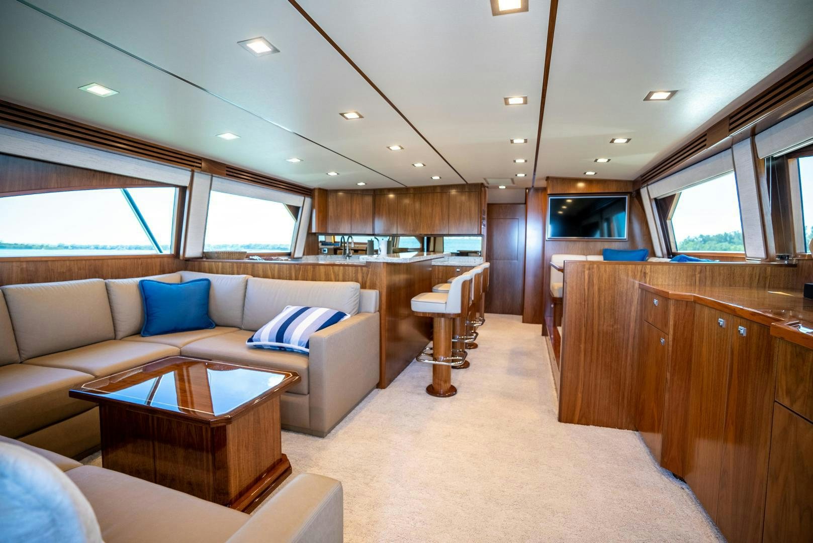 a living room with a couch and a table aboard Leslie Ann Yacht for Sale