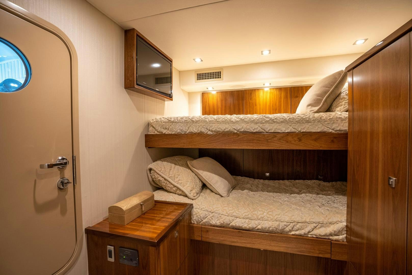 a bed with a mirror above it aboard Leslie Ann Yacht for Sale