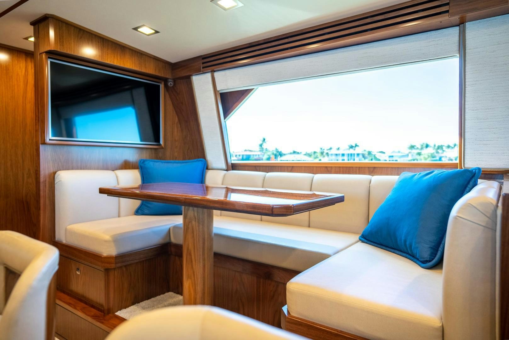a room with a couch and a table and a window aboard Leslie Ann Yacht for Sale
