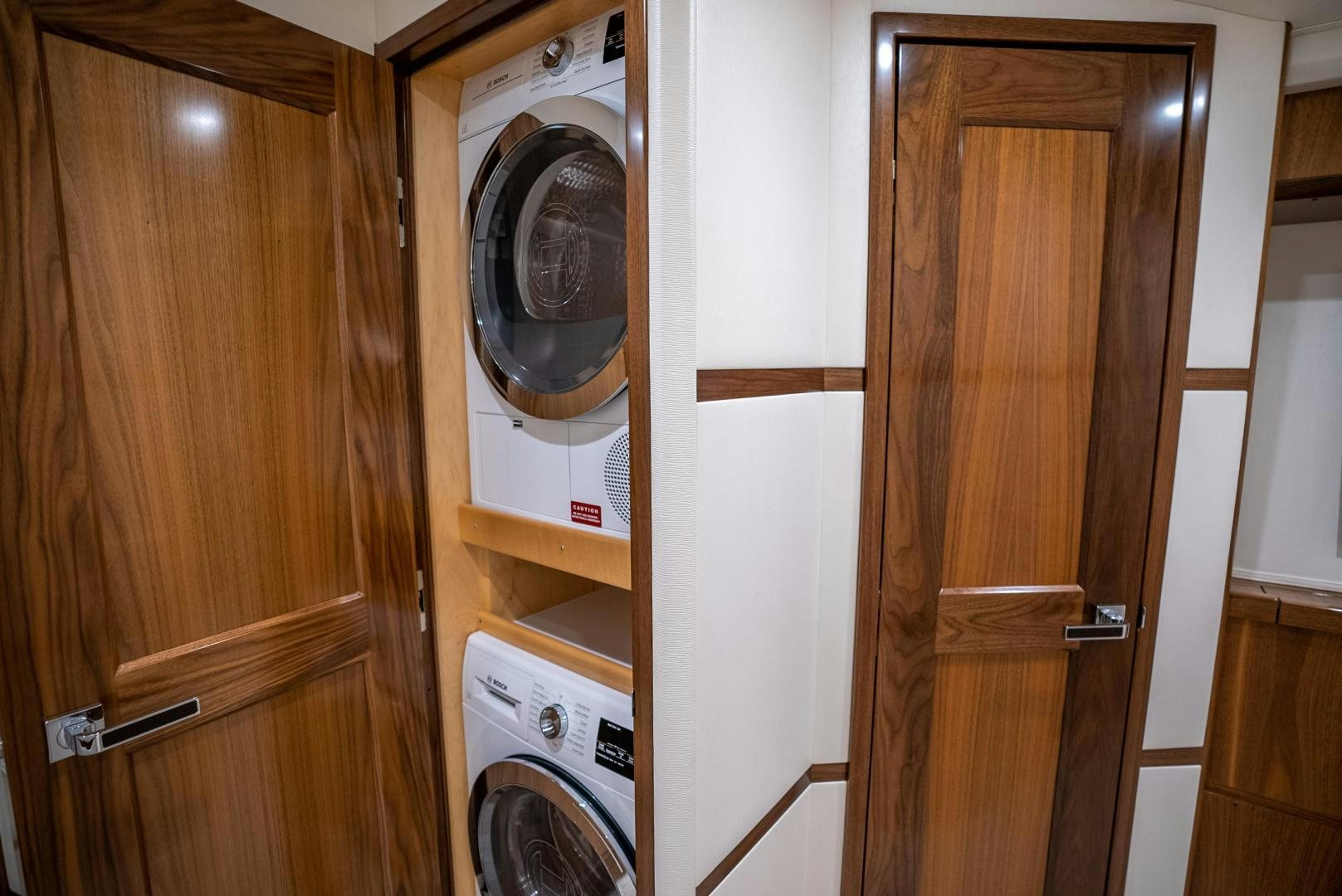a washer and dryer in a room aboard Leslie Ann Yacht for Sale