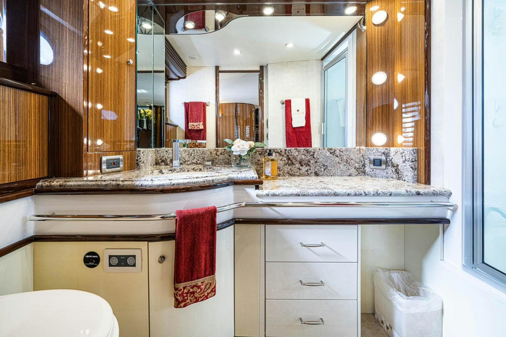 a bathroom with a large mirror aboard AWAKEN Yacht for Sale