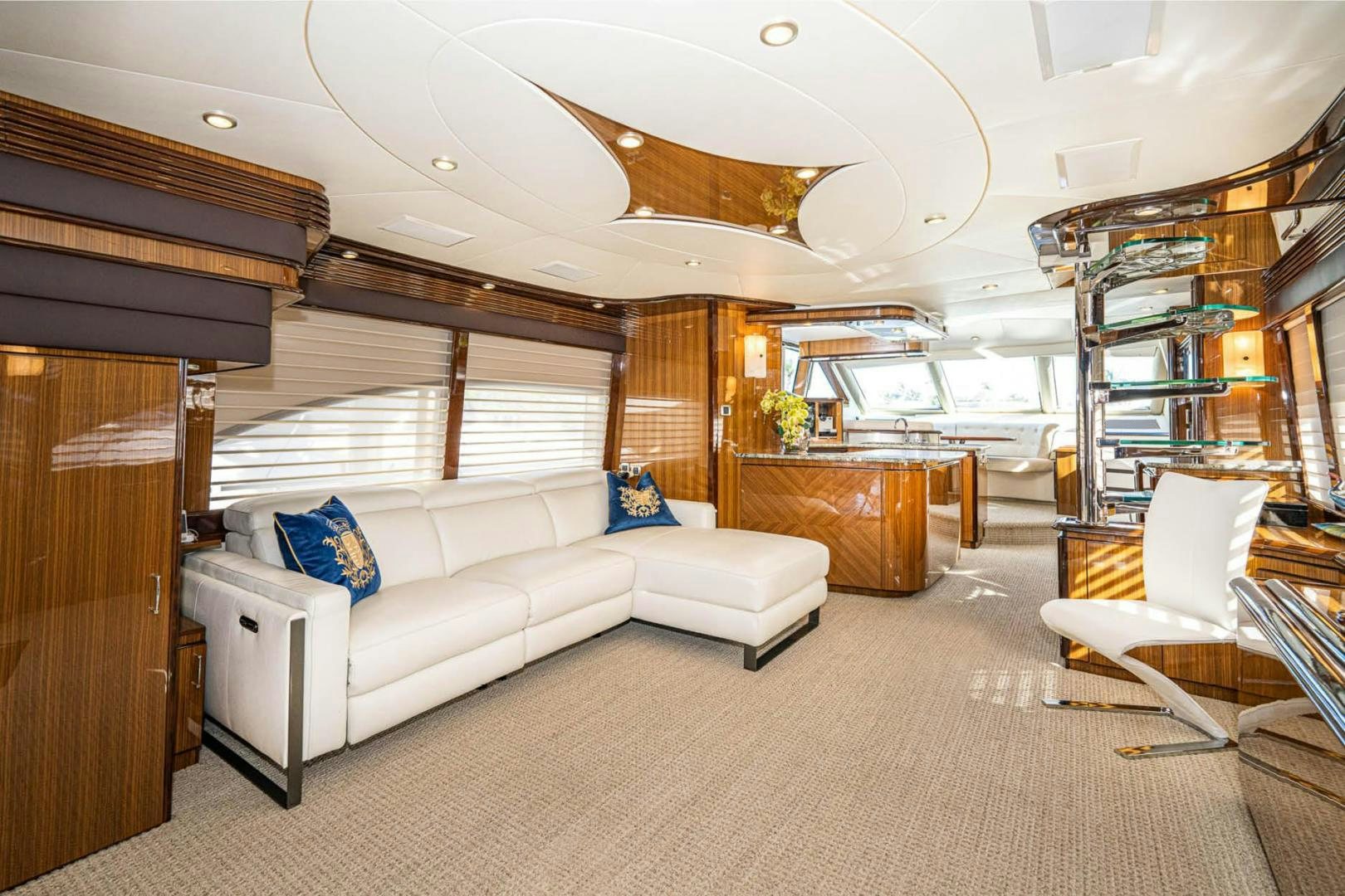 a living room with a white couch aboard AWAKEN Yacht for Sale