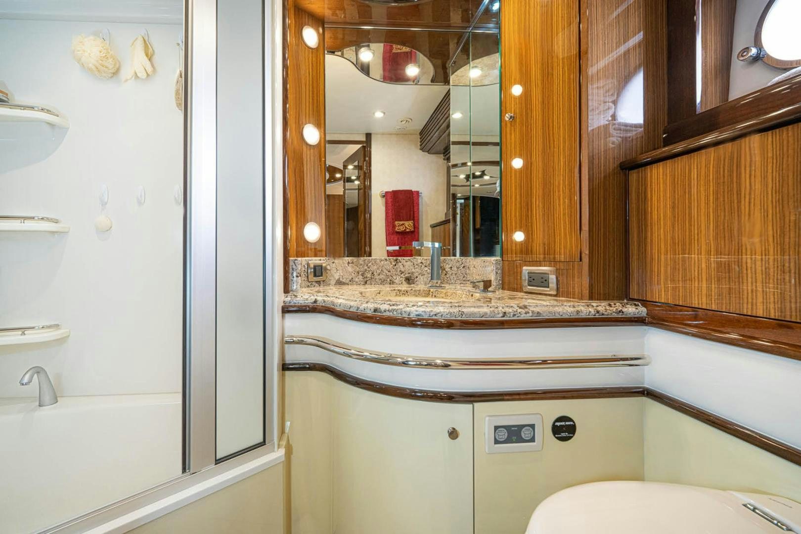 a bathroom with a marble counter top aboard AWAKEN Yacht for Sale
