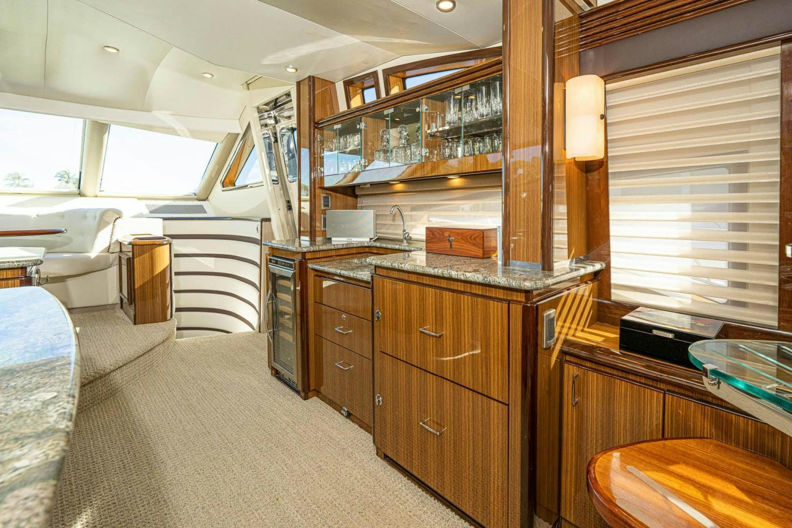 a room with a large cabinet and a large window aboard AWAKEN Yacht for Sale