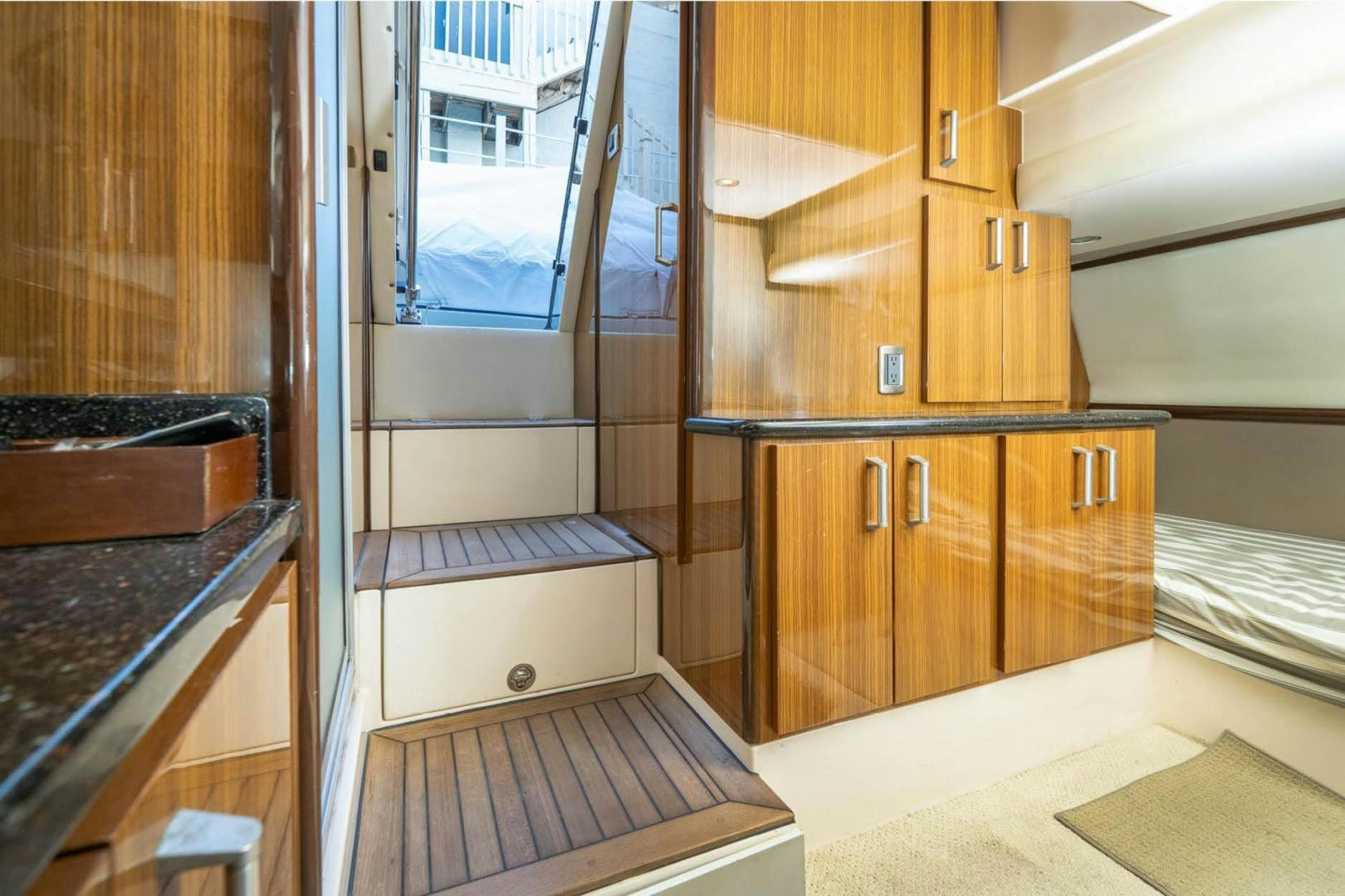 a kitchen with wooden cabinets aboard AWAKEN Yacht for Sale