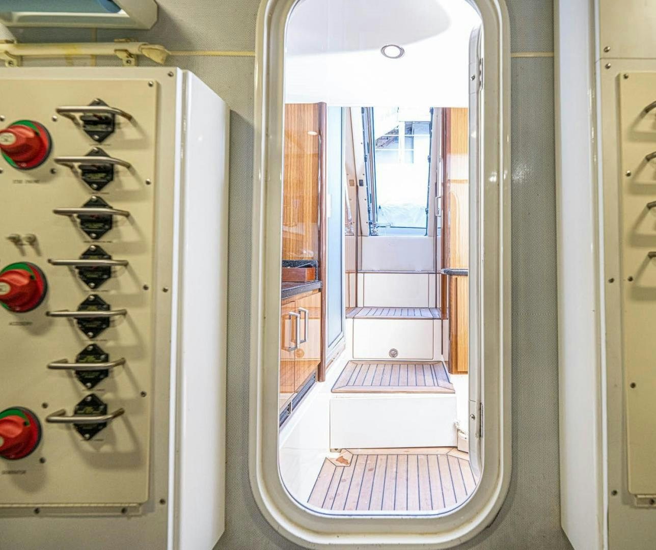 a room with a glass door aboard AWAKEN Yacht for Sale