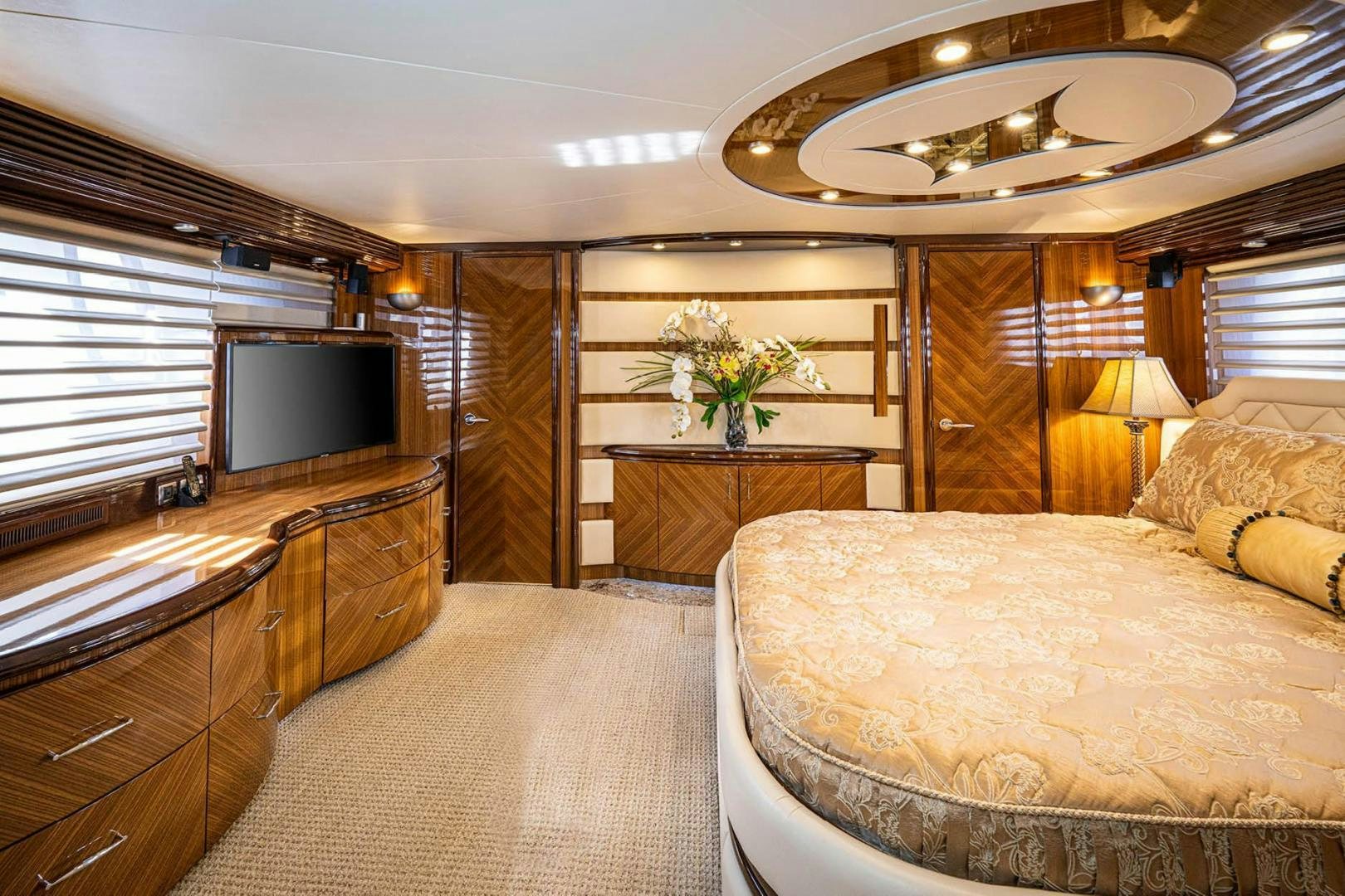 a bedroom with a large bed aboard AWAKEN Yacht for Sale