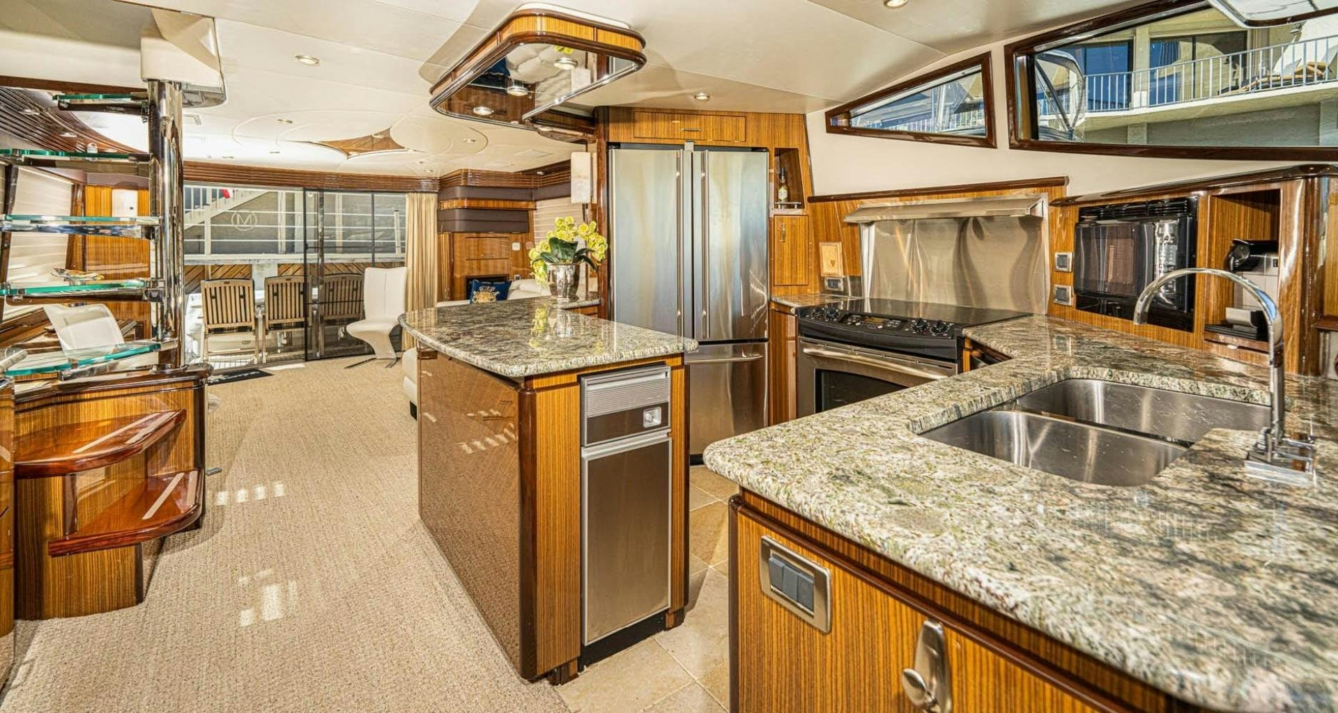 a kitchen with a large island aboard AWAKEN Yacht for Sale