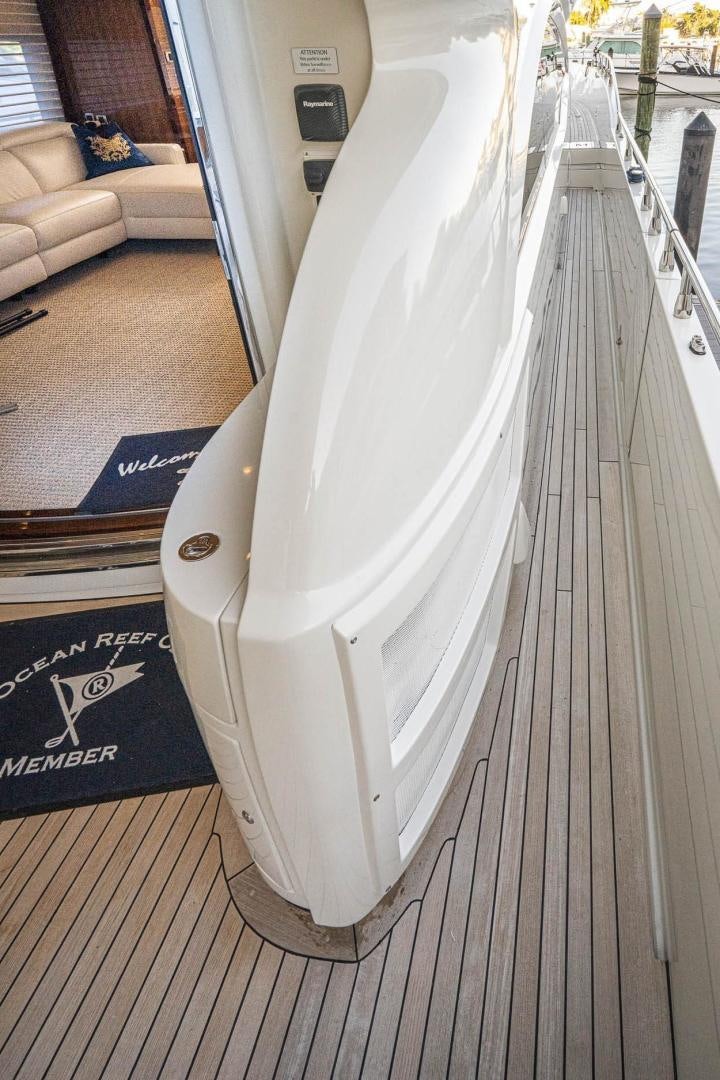 a white rectangular object on a wooden surface aboard AWAKEN Yacht for Sale