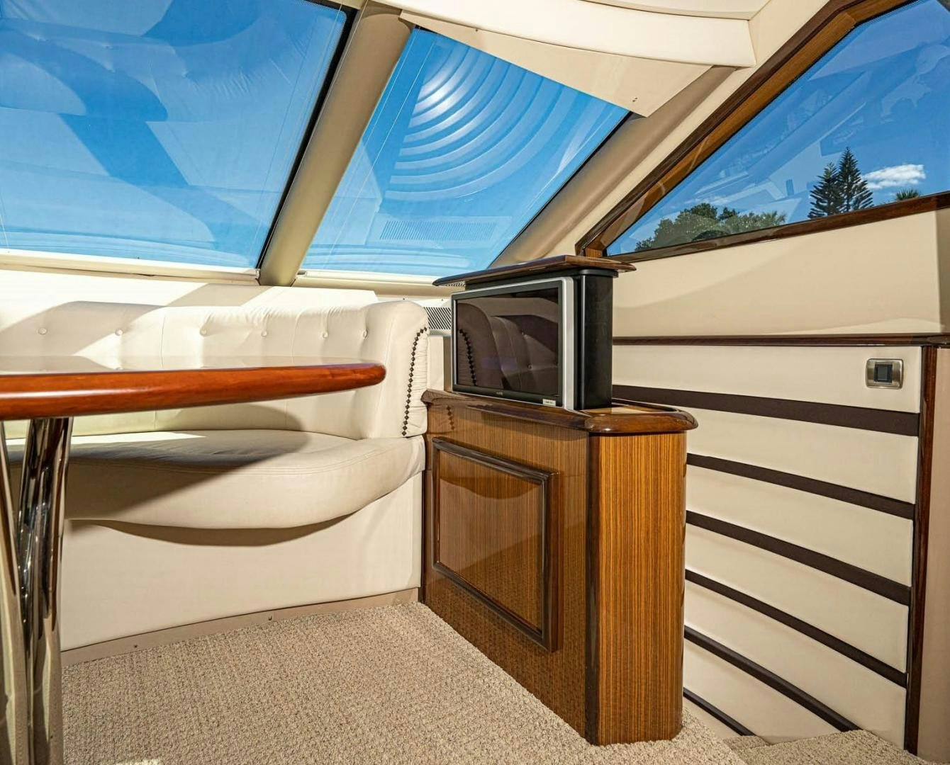 a room with a bed and a television aboard AWAKEN Yacht for Sale