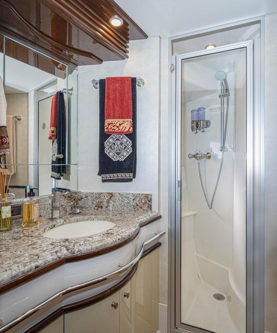 a bathroom with a sink and a mirror aboard AWAKEN Yacht for Sale