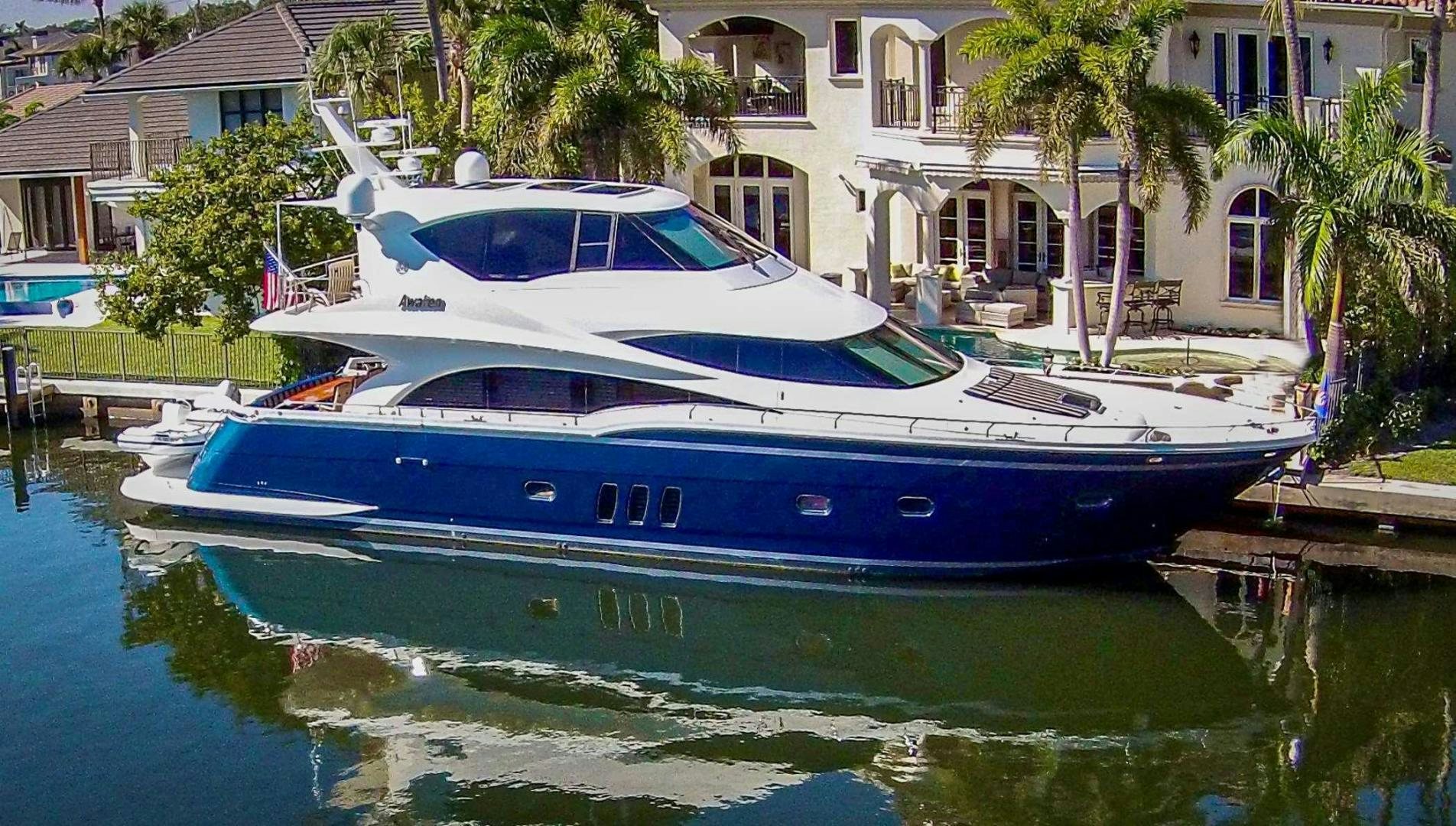 a boat docked at a pier aboard AWAKEN Yacht for Sale