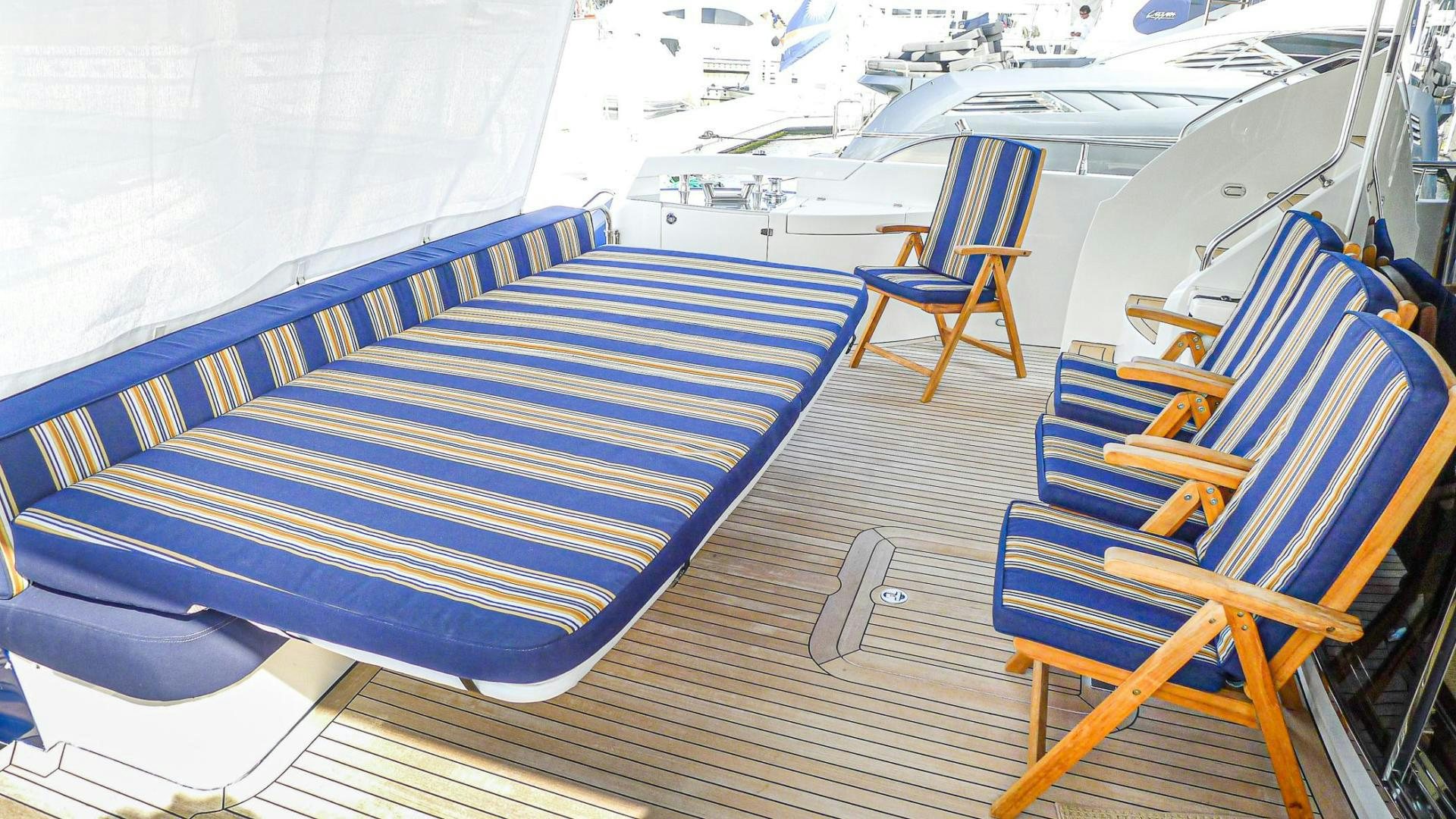 a row of blue chairs aboard AWAKEN Yacht for Sale
