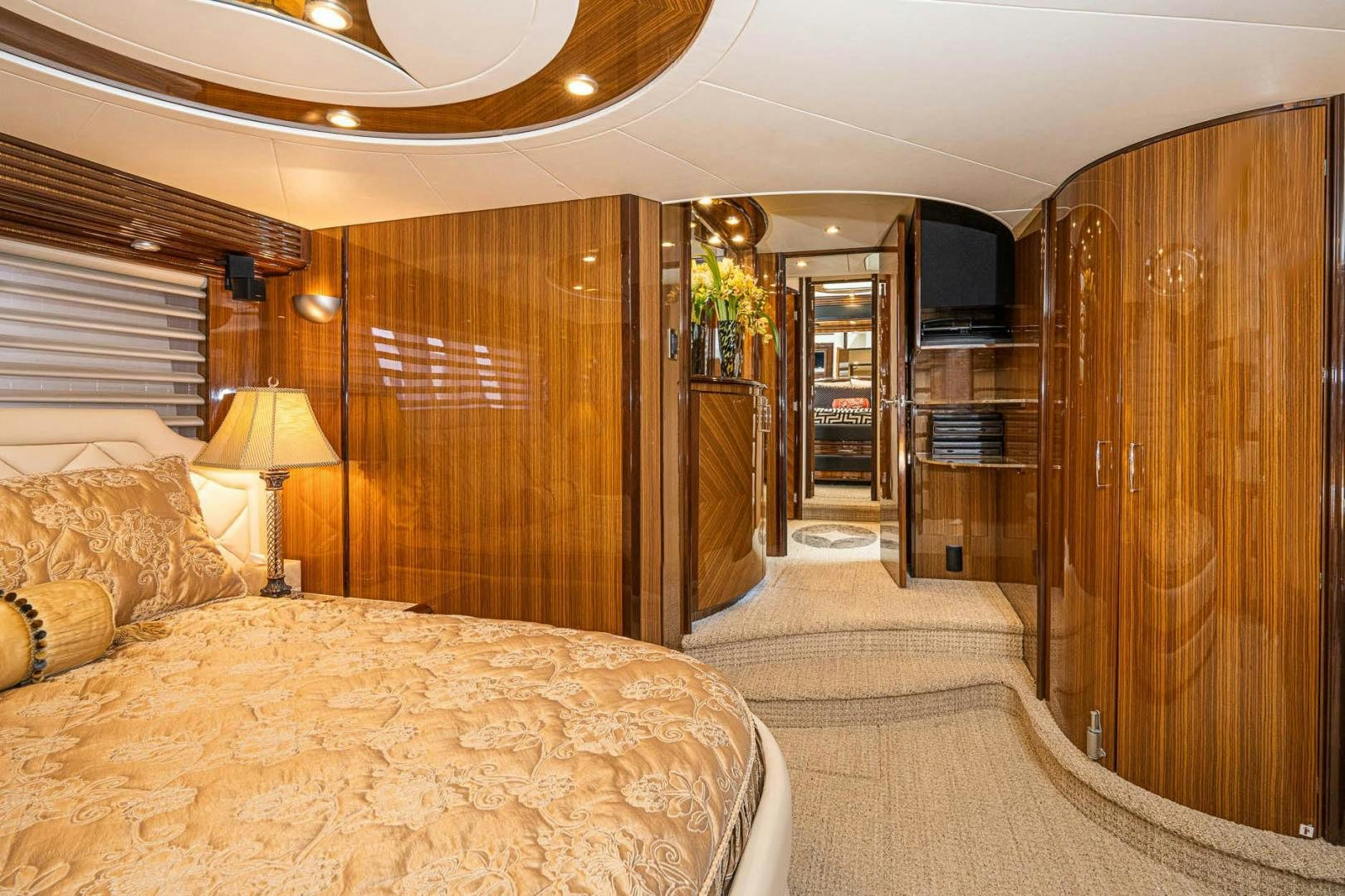 a bedroom with a bed and a closet aboard AWAKEN Yacht for Sale