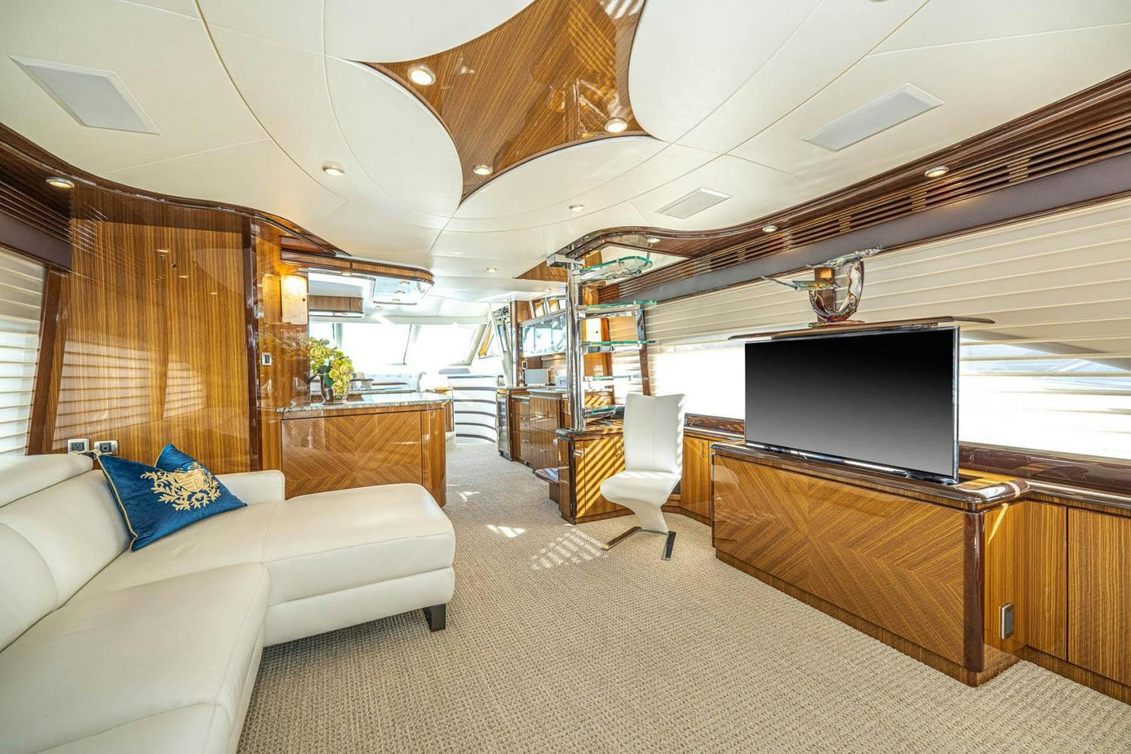 a living room with a large tv aboard AWAKEN Yacht for Sale
