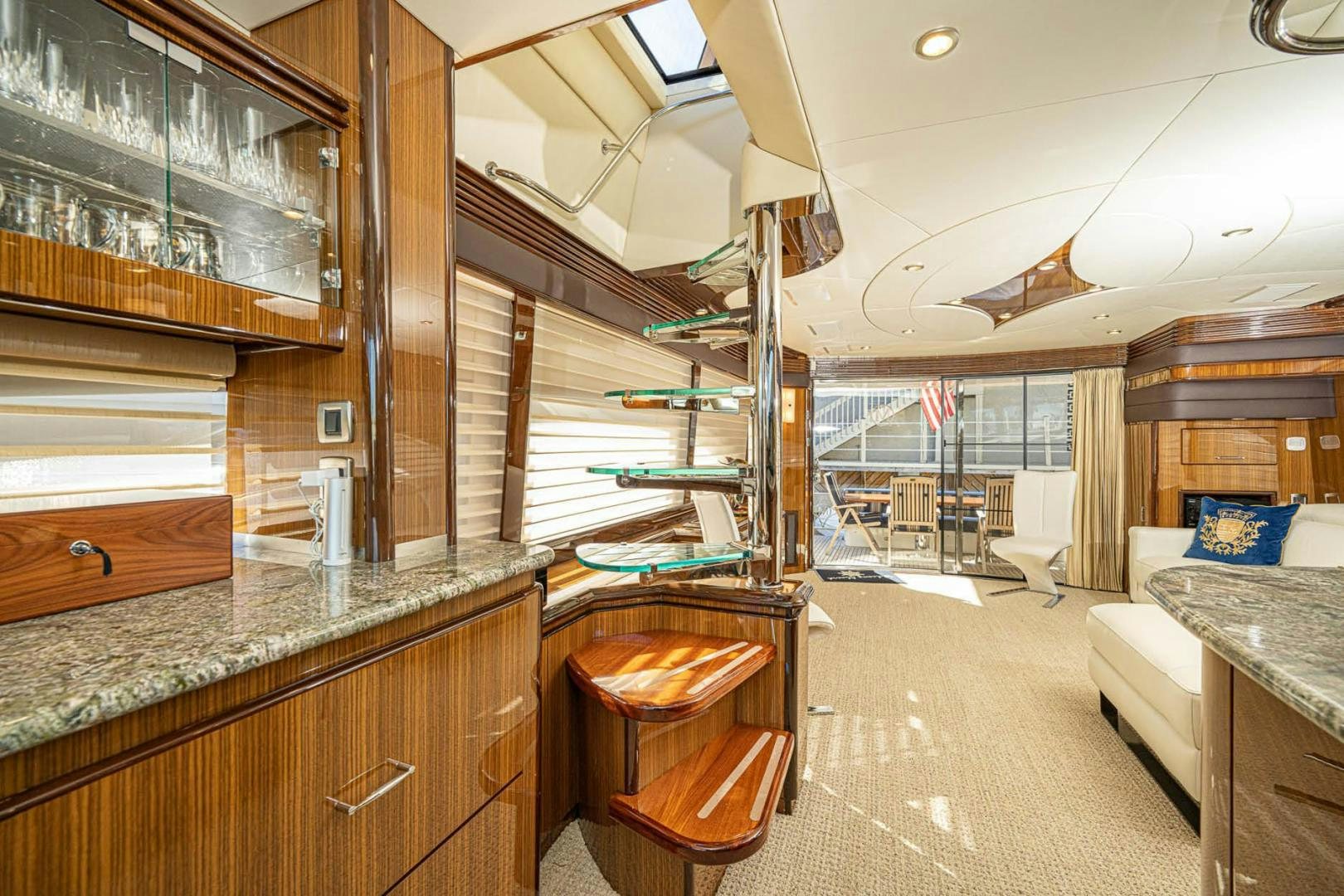 a large room with a bed and a desk aboard AWAKEN Yacht for Sale