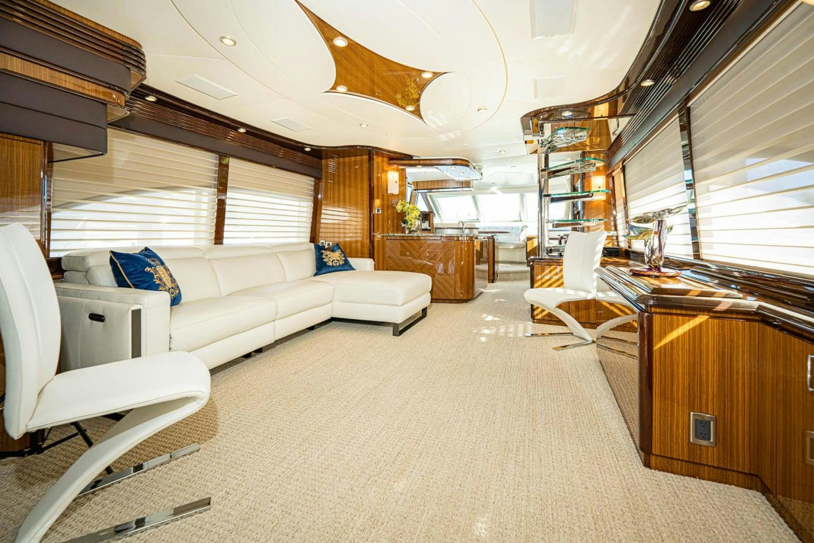 a room with a couch and a table aboard AWAKEN Yacht for Sale