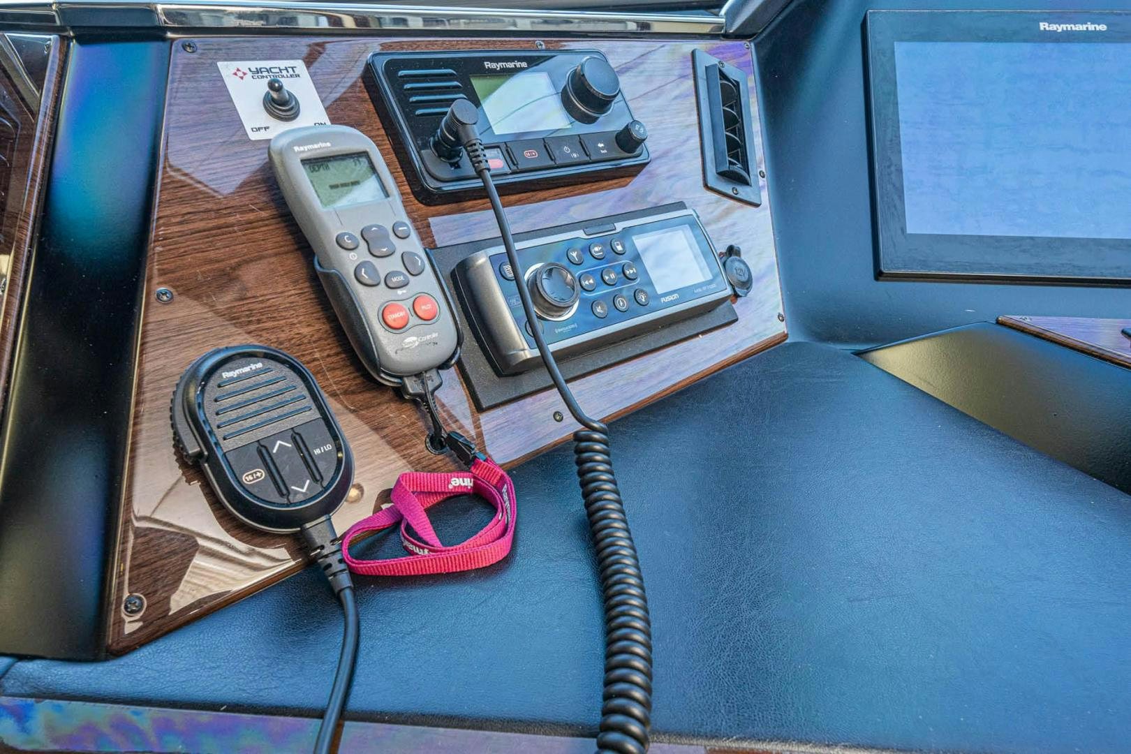 a group of electronic devices on a table aboard AWAKEN Yacht for Sale