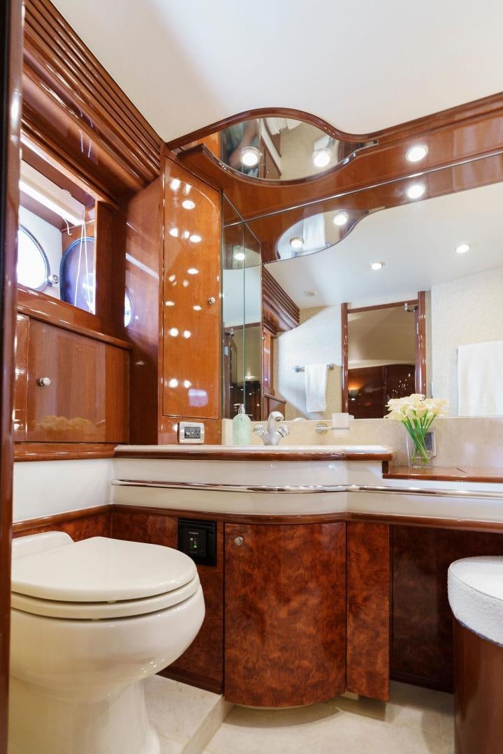 a bathroom with a large mirror aboard LA BELLA VITA Yacht for Sale