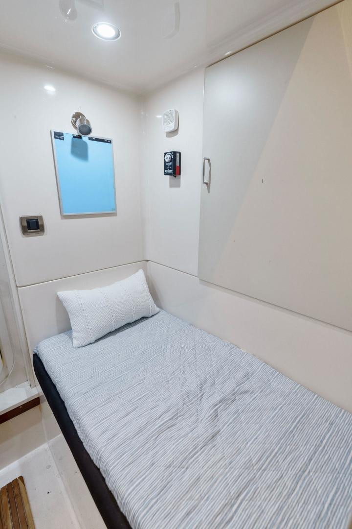 a bed with white sheets aboard LA BELLA VITA Yacht for Sale