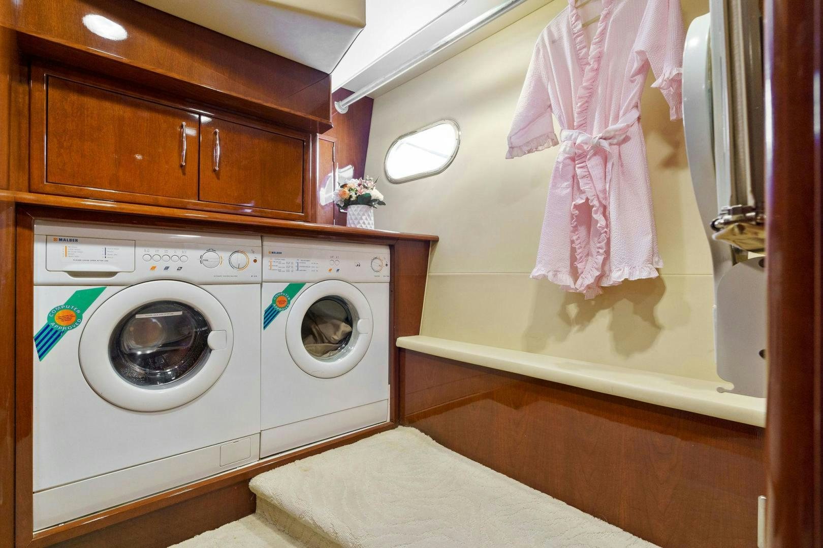 a washing machine in a room aboard LA BELLA VITA Yacht for Sale