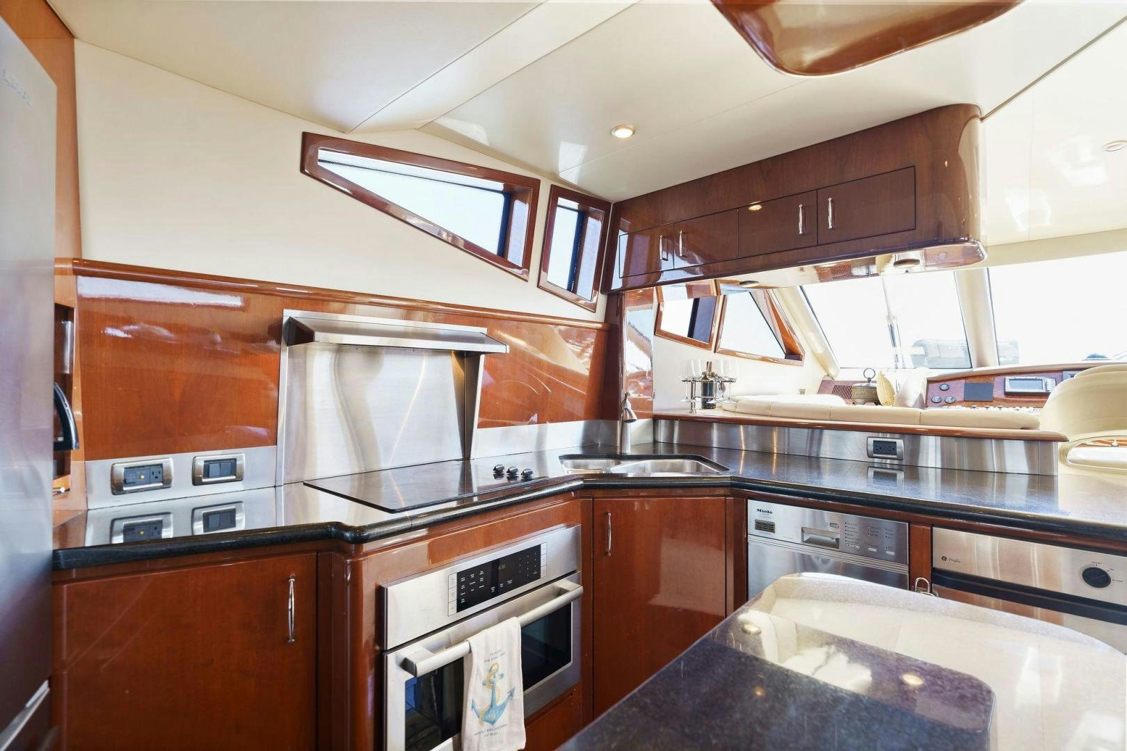 a kitchen with wooden cabinets aboard LA BELLA VITA Yacht for Sale