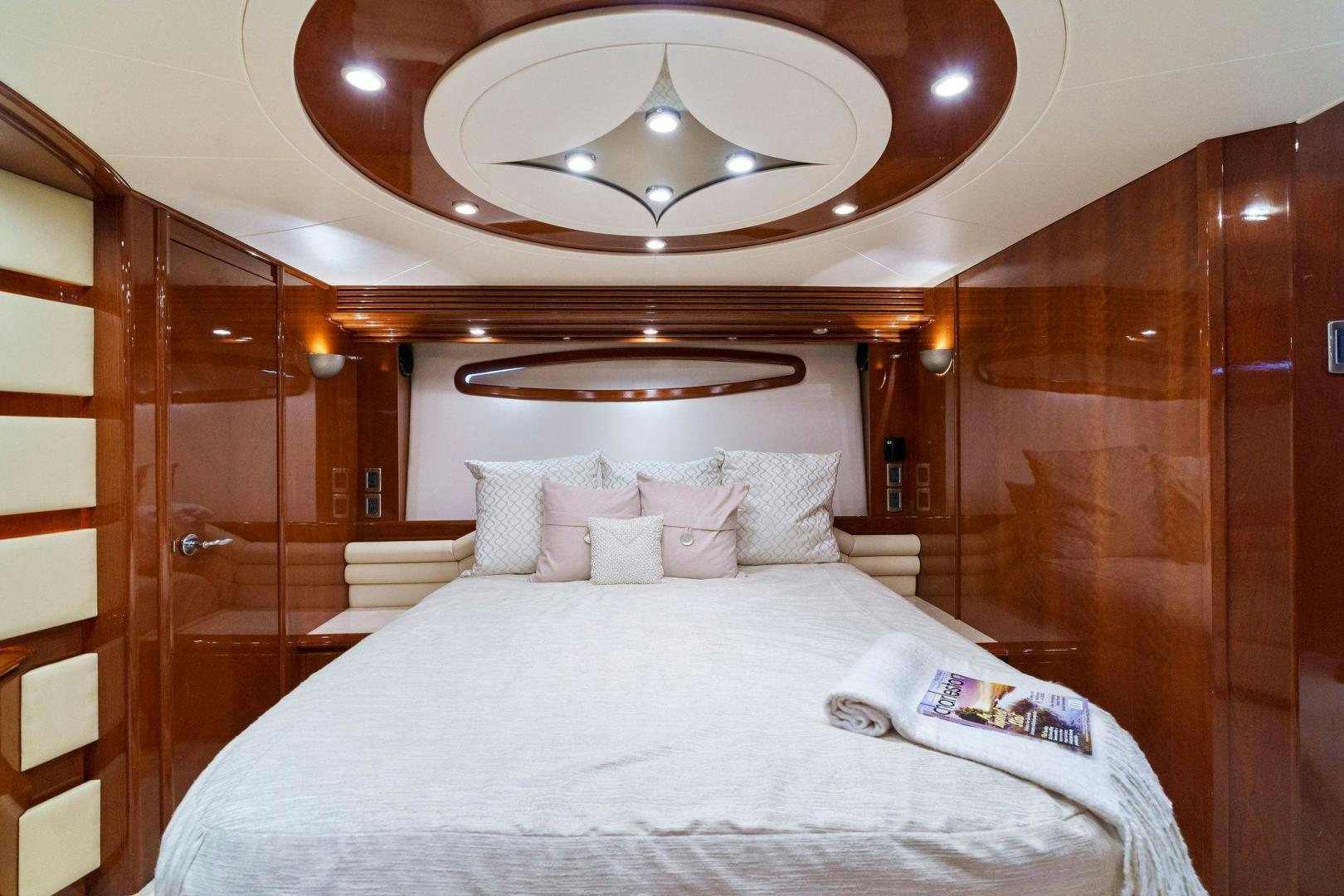 a bed with white sheets aboard LA BELLA VITA Yacht for Sale