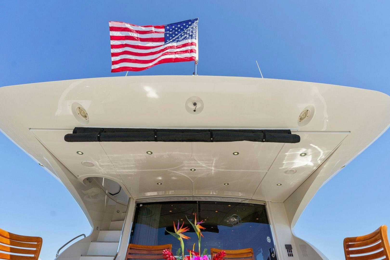 a military jet with a flag on the front aboard LA BELLA VITA Yacht for Sale