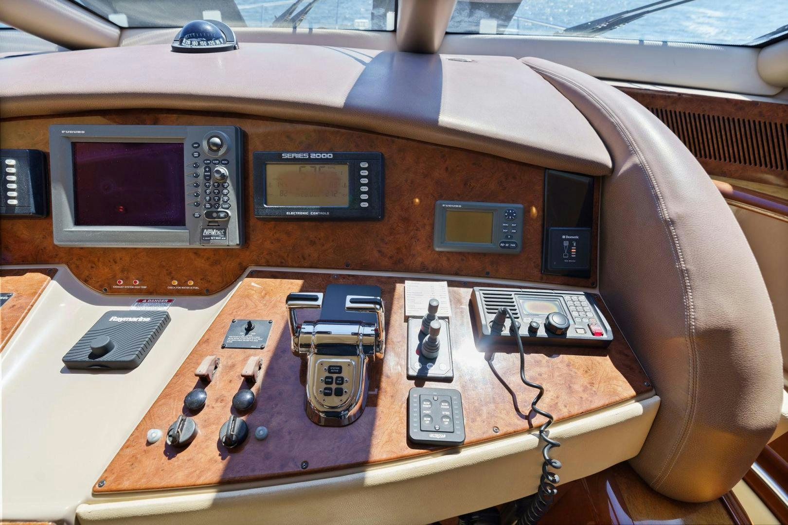 a brown guitar with a red and white case and a black case with buttons and a white guitar aboard LA BELLA VITA Yacht for Sale