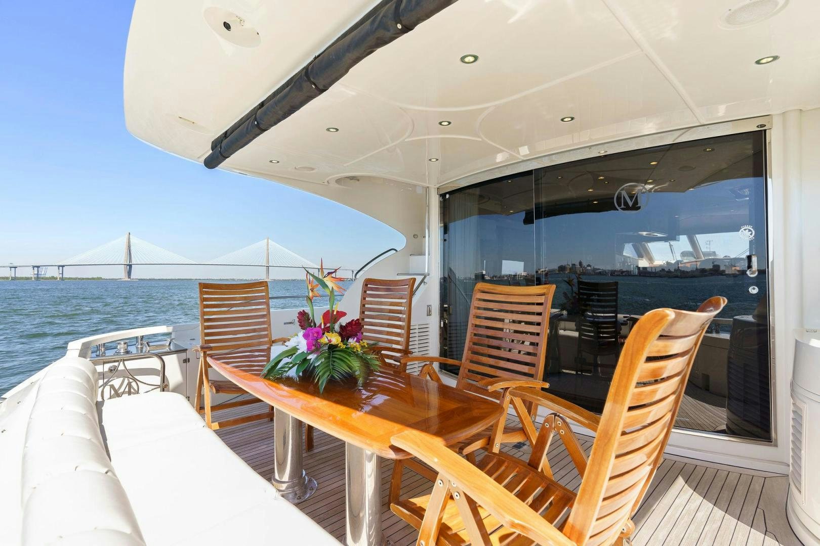 a table and chairs on a boat aboard LA BELLA VITA Yacht for Sale