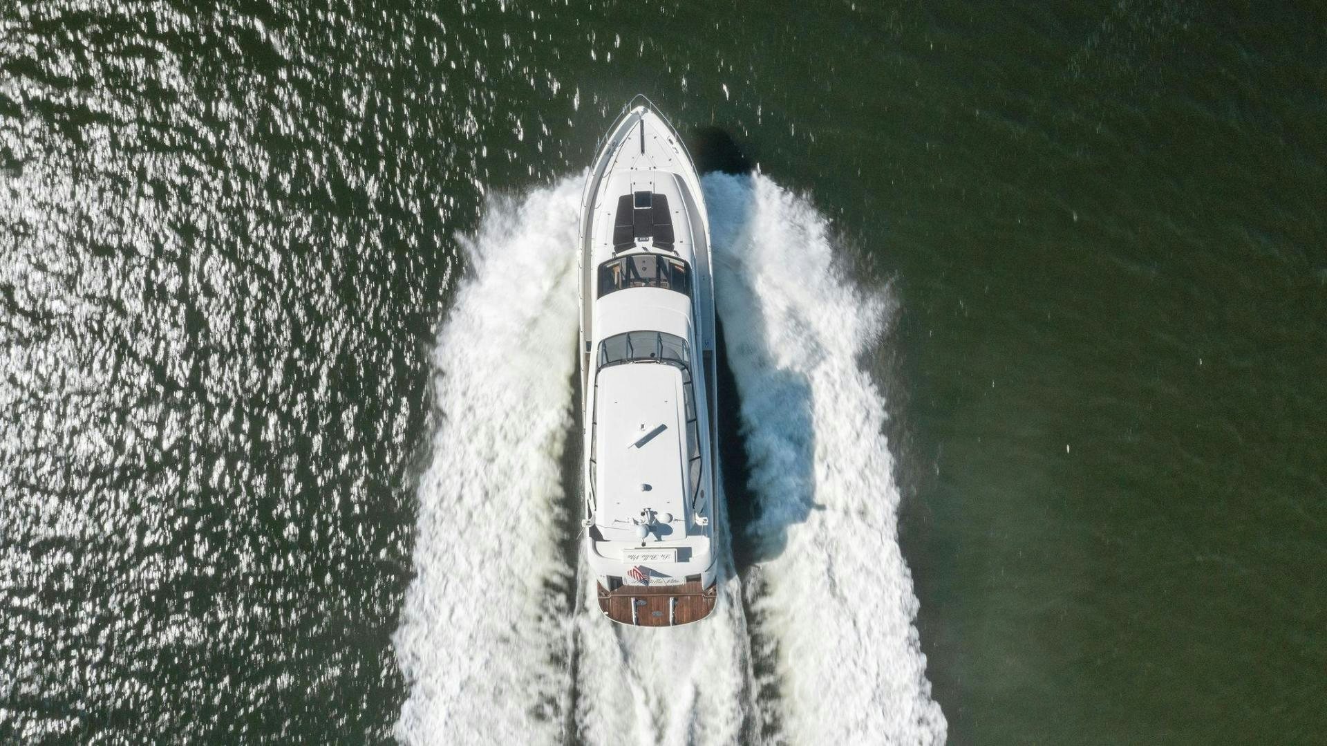 a white and black boat in the water aboard LA BELLA VITA Yacht for Sale