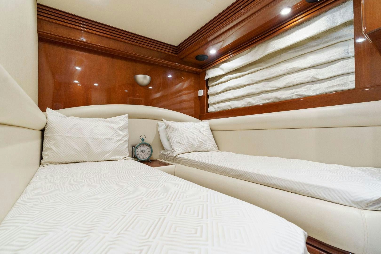 a bed with white sheets aboard LA BELLA VITA Yacht for Sale