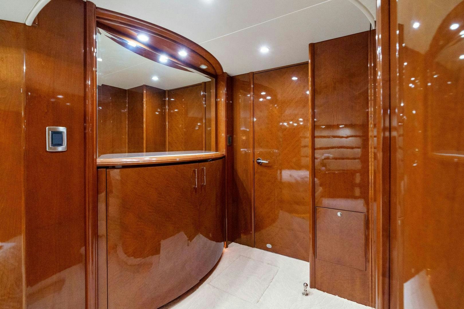 a bathroom with wooden cabinets aboard LA BELLA VITA Yacht for Sale