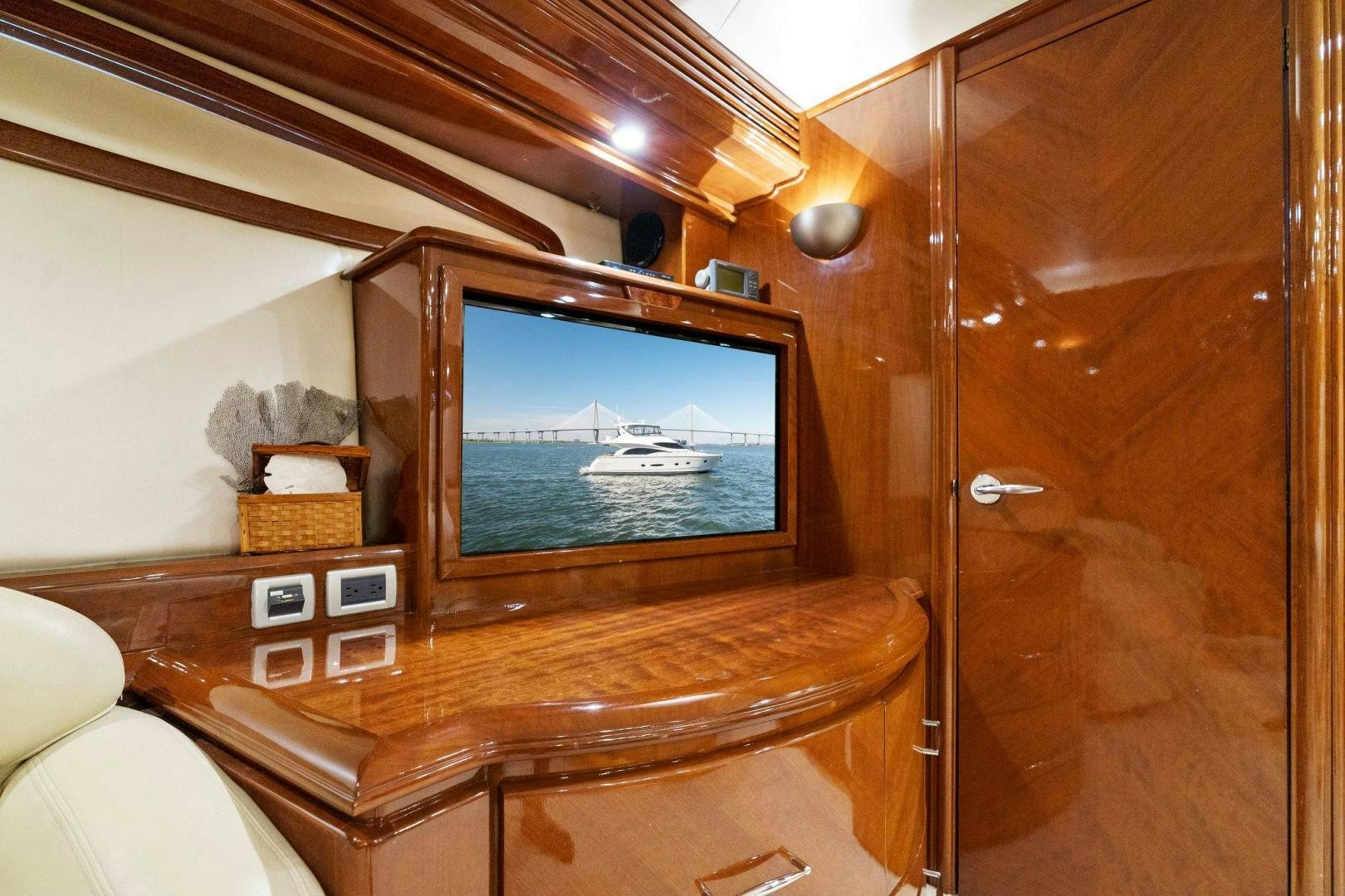 a tv on a table aboard LA BELLA VITA Yacht for Sale